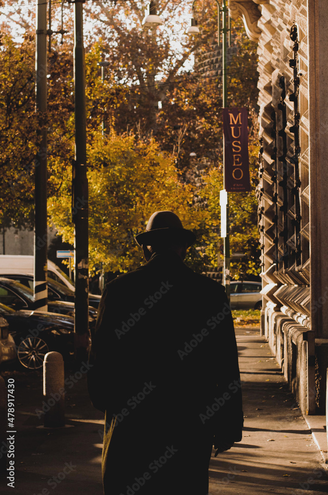 Elegant Man In Hat Walking On Autumn Street Elegant Man In Hat Walking On Autumn Street