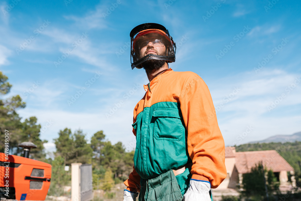 Confident lumberjack in sunny forest Confident lumberjack in sunny forest