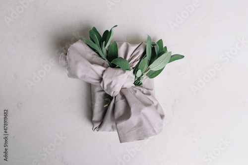 Still Life Of Wrapped Gift With Furoshiki And Ornament photo