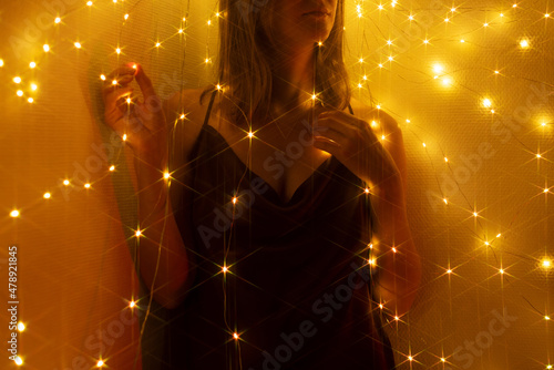 Woman surrounded by lights photo