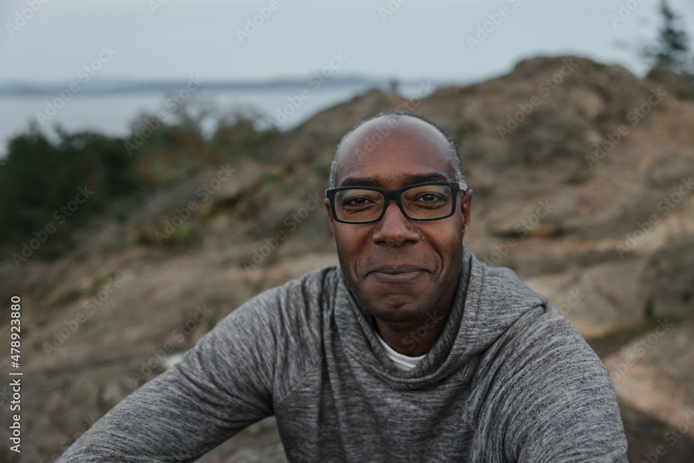 Man sitting in nature in the evening
Man sitting in nature in the evening