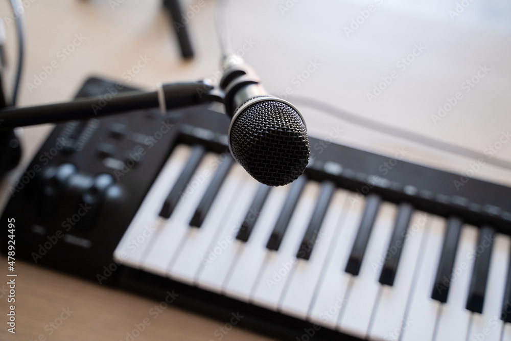 Microphone And Electric Piano On The Table Microphone And Electric Piano On The Table