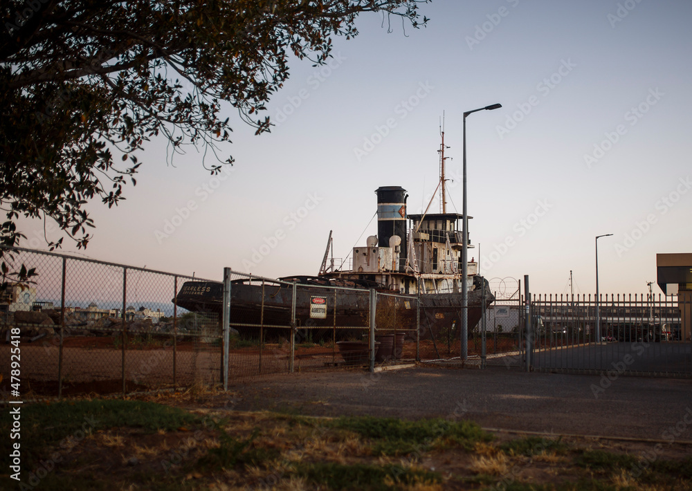 old black wrecked ship in sunset in Adelaide, South Australia old black wrecked ship in sunset in Adelaide, South Australia