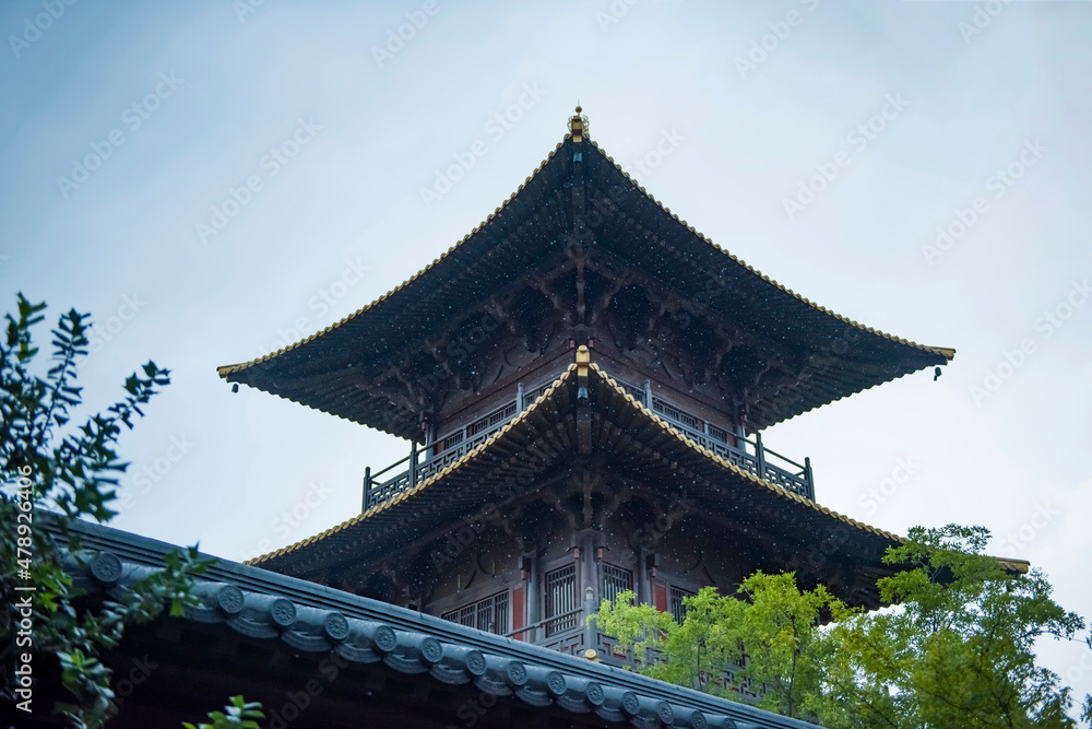 Fototapeta premium the china ancient pagoda architecture in rainy day.