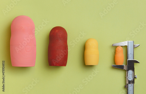 Wooden dolls measured with a calliper