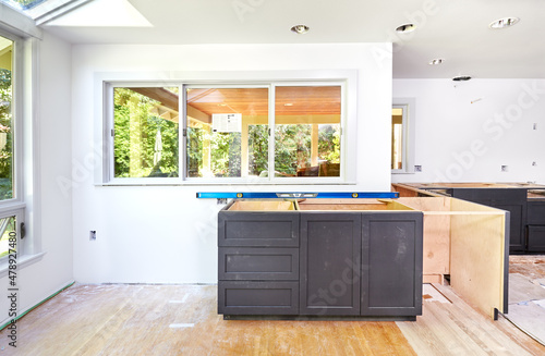 Kitchen sink cabinet - Custom kitchen cabinets placed and leveled