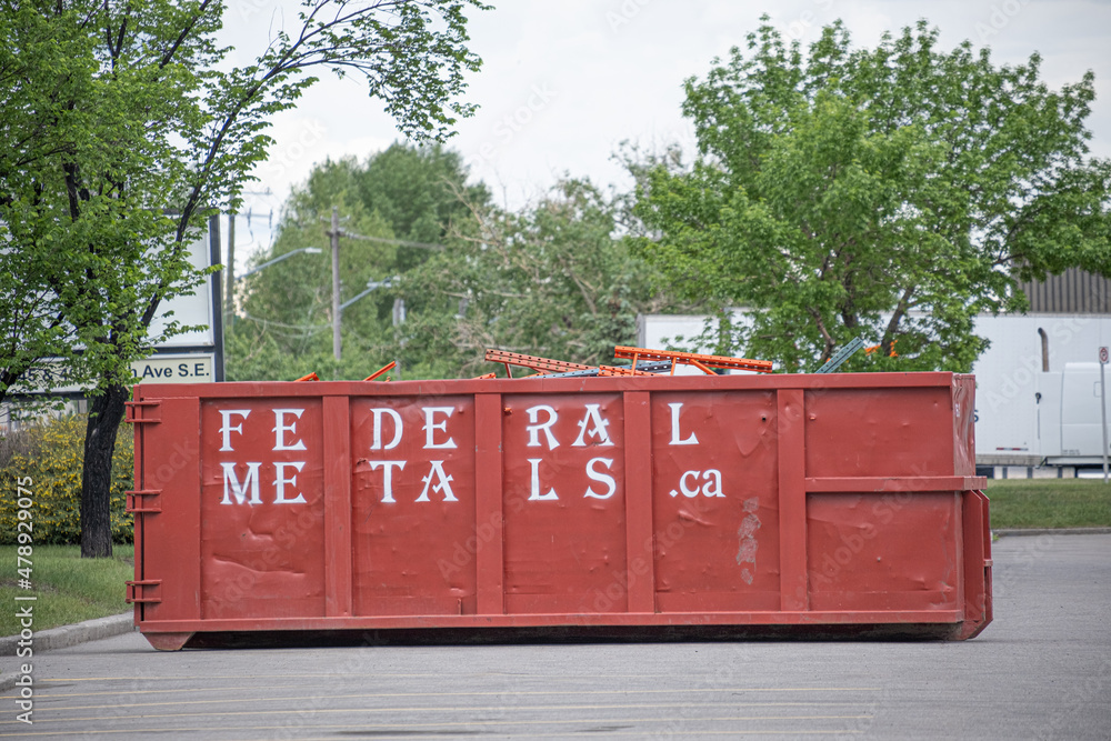 June 6 2021 Calgary Alberta Canada Garbage bin filled with scrap