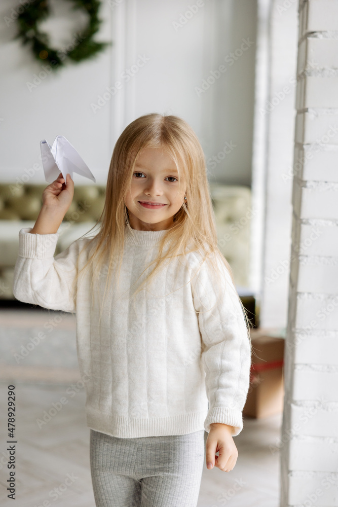 Little Girl launching paper airplane Little Girl launching paper airplane