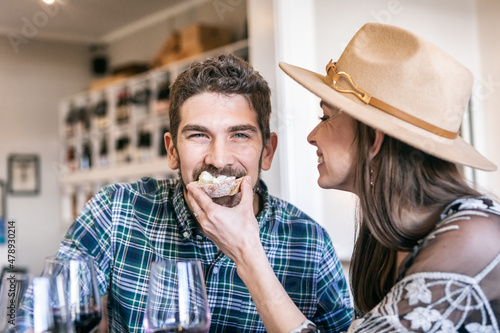 Man Takes Bite Of Cheese And Bread