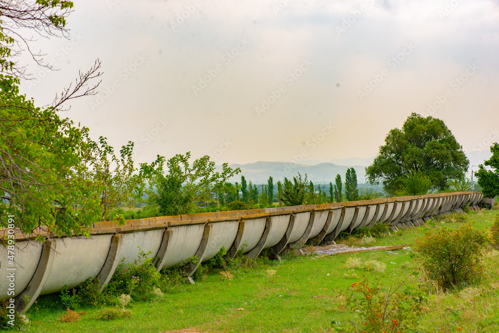 Fototapeta premium the water ditch goes through the fields