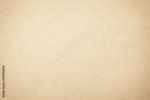 Brown recycled craft paper texture as background. Cream paper texture, Old vintage page or grunge vignette. 
