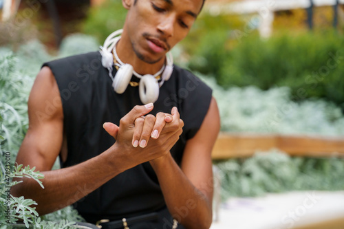 Crop Portrait of sylish handsome man wearing headphones photo