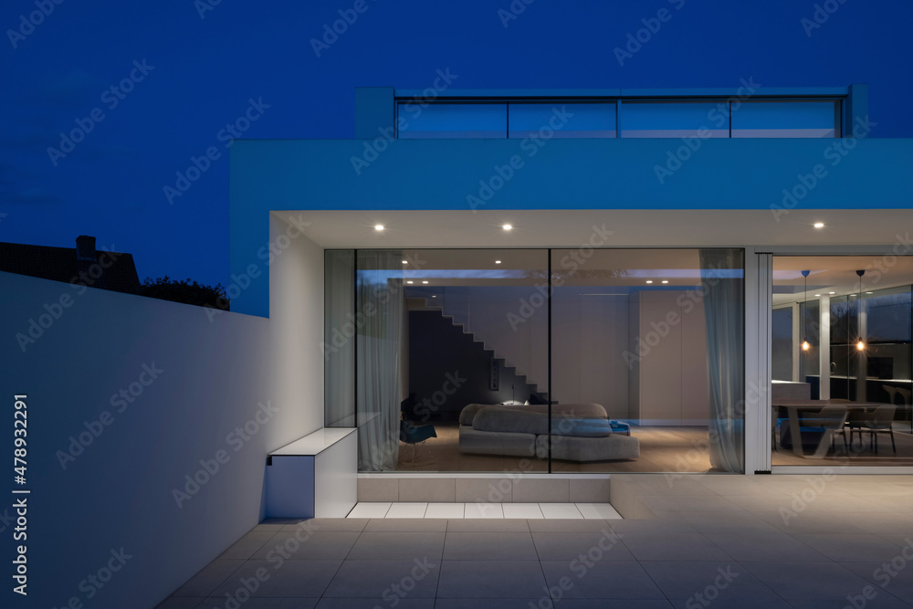 © Koen Van Damme/Stocksy - villa at dusk