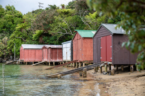 Old boat sheds along the coast near Oban, in Stewart Island, New Zealand © Dillon Anderson