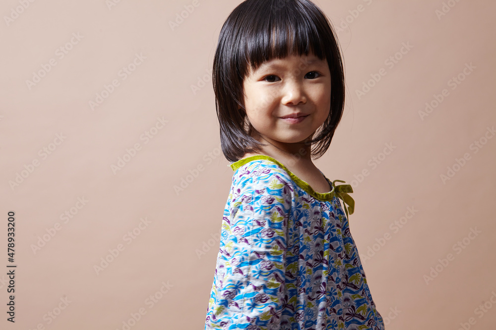 Cute Asian little girl dancing and playing indoors
Cute Asian little girl dancing and playing indoors