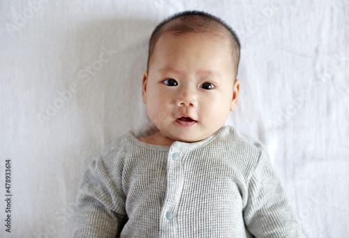 Closeup expression of Asian newborn baby