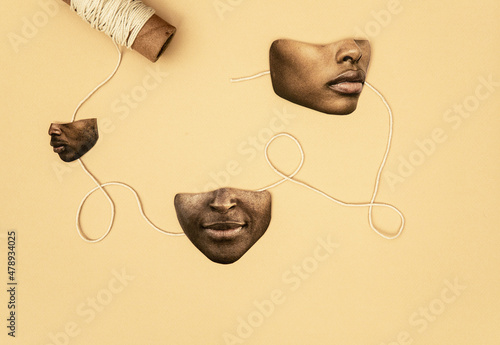 Anonymous faces with string concept photo