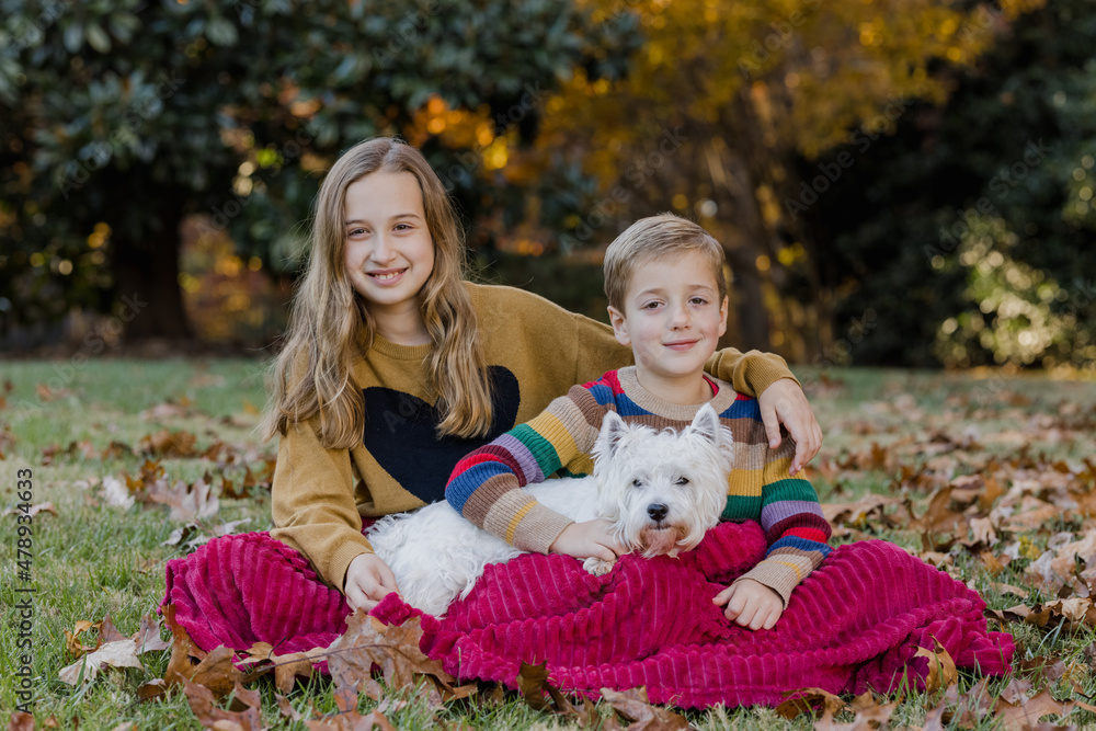 Two children and a dog on a blanket Two children and a dog on a blanket