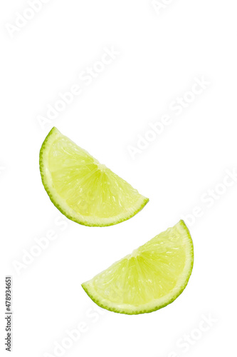 Two slices of lime on a white background with copy space.