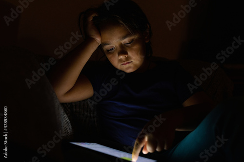 Schoolboy Using A Digital Tablet photo