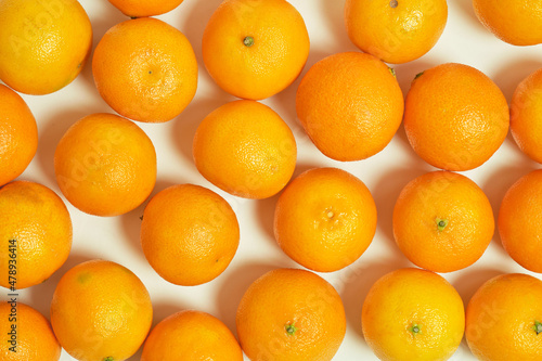 Background fresh tangerines top view, fruits and citrus fruits.