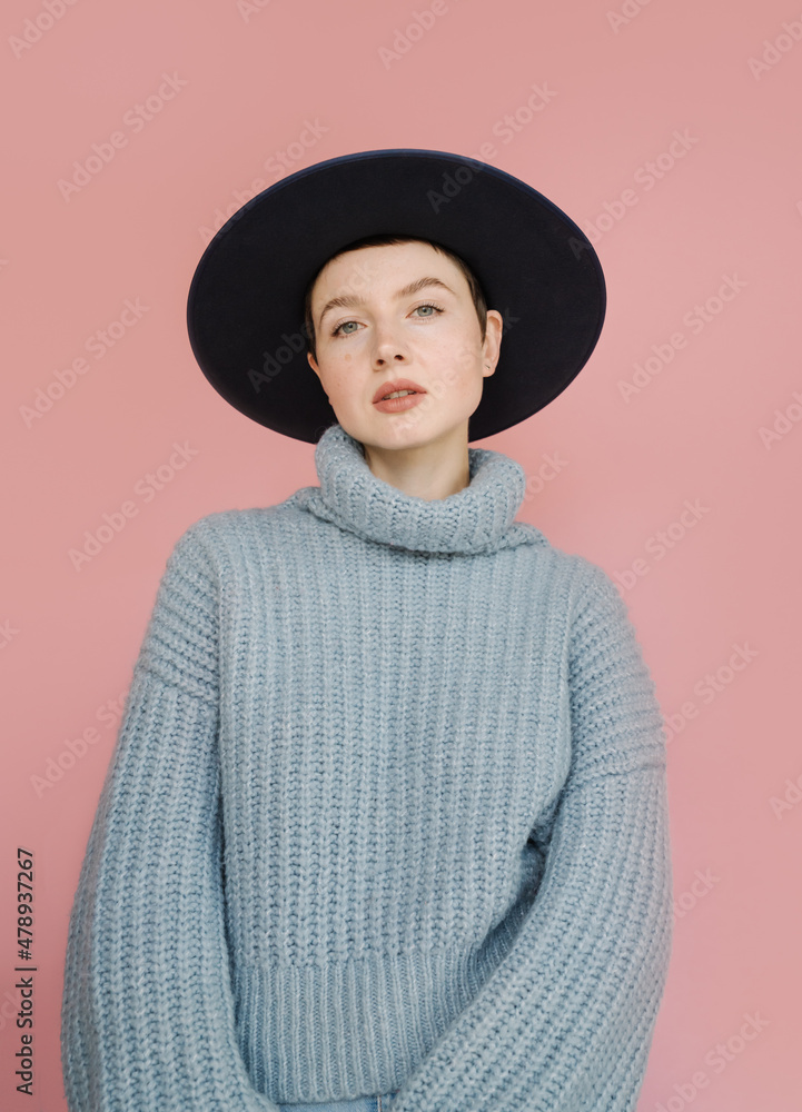 Studio Portrait. Woman Wearing Sweater And Hat Studio Portrait. Woman Wearing Sweater And Hat