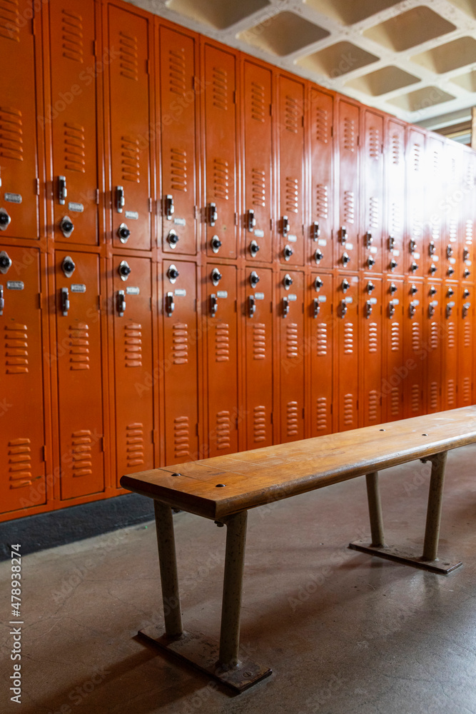 Empty Orange Locker room in School Empty Orange Locker room in School