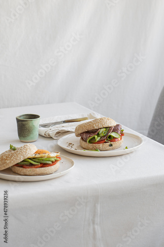 Diferents sandwichs and bagels on the style table. photo