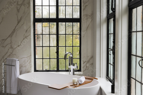 View of a bathroom with large windows photo