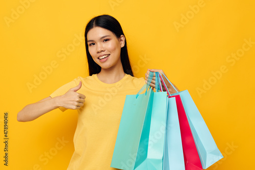 Portrait Asian beautiful young woman fashion shopping posing isolated background unaltered