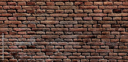 Old red brick wall. Texture of old dark brown and red brick wall