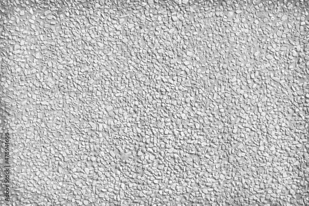 Fototapeta premium White small rock in seamless patterns decorative on concrete wall on grey background