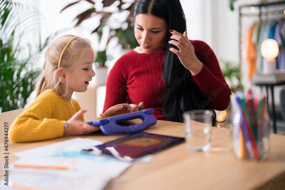 Nanny and girl studying together Nanny and girl studying together