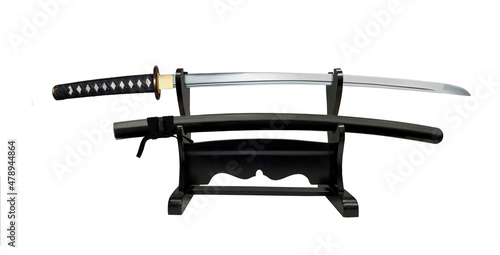Japanese sword on double display stand on white background