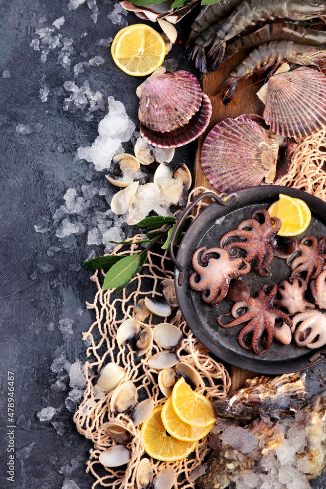 Fresh seafood arrangement on dark background. Fresh seafood arrangement on dark background.
