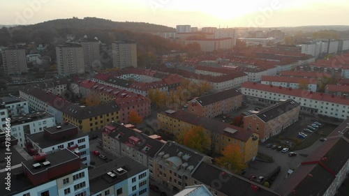 Panoramic Aerial Drone View Of Building Rooftops In Hisingen. Sunset In Autumn In Gothenburg, Sweden. panning left photo