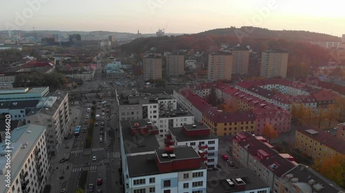 Rush Hour Traffic During Sunset On Hisingen In Gothenburg, Sweden During Autumn. aerial panning photo