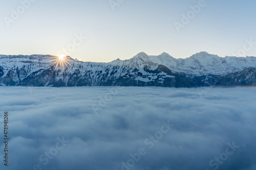 Sunrise in the snowy alps of Switzerland. photo