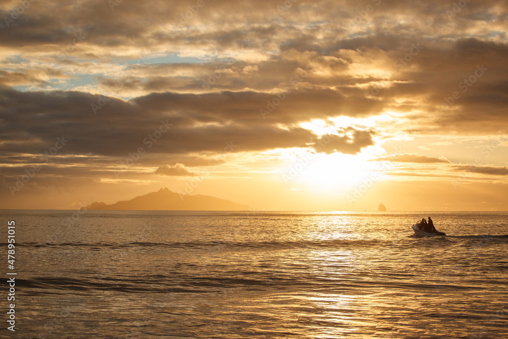 People in a recreational boat head out to sea People in a recreational boat head out to sea
