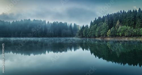 Beautiful scenic view of Savsat Karagol Black lake in Eastern Black Sea region with morning evaporation. Savsat Karagol lake is a large trout lake in the forest in Artvin, Turkey