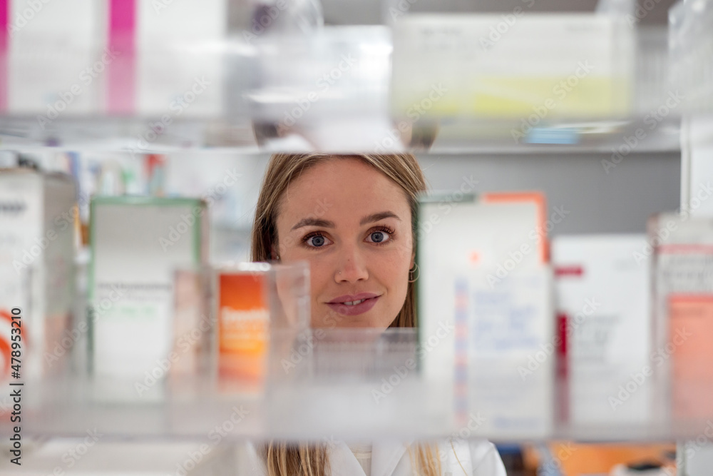 Pharmacist choosing box of remedy Pharmacist choosing box of remedy