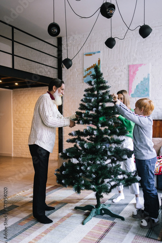 Family admiring Christmas time at home