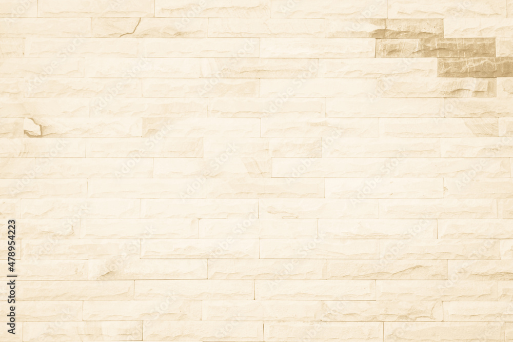 Cream and beige brick wall texture background. Brickwork and stonework flooring interior rock old pattern design. Background of old vintage brick wall backdrop