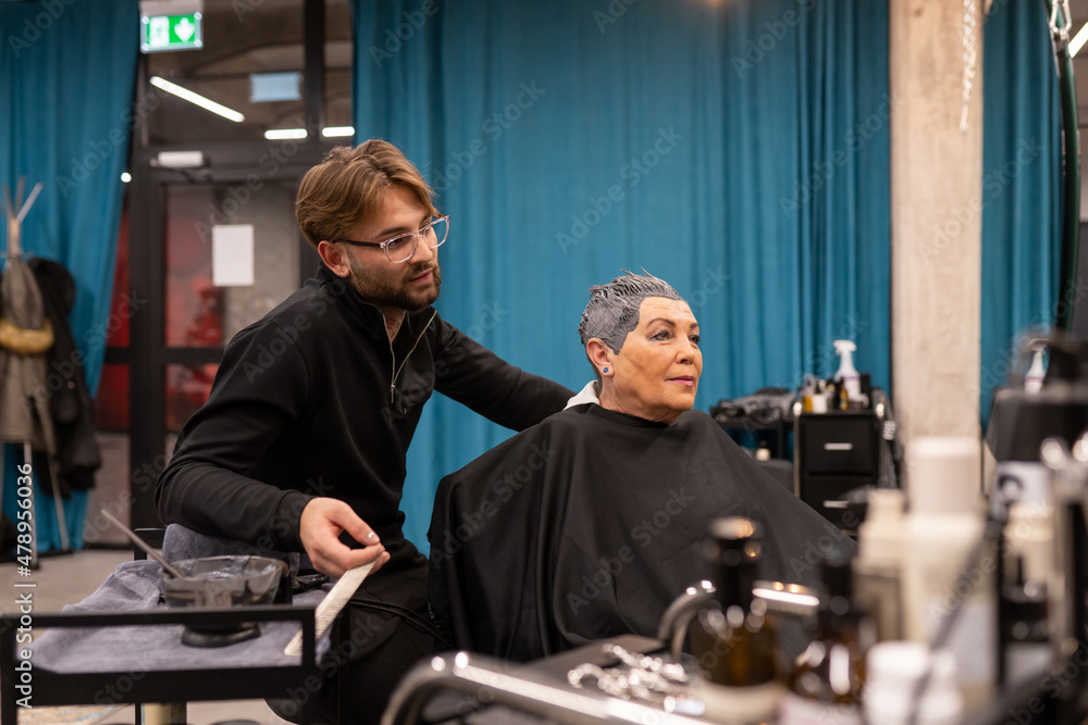 Woman With Hairstylist At Beauty Salon Woman With Hairstylist At Beauty Salon