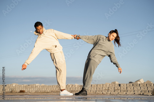 Friends balancing helping each other 