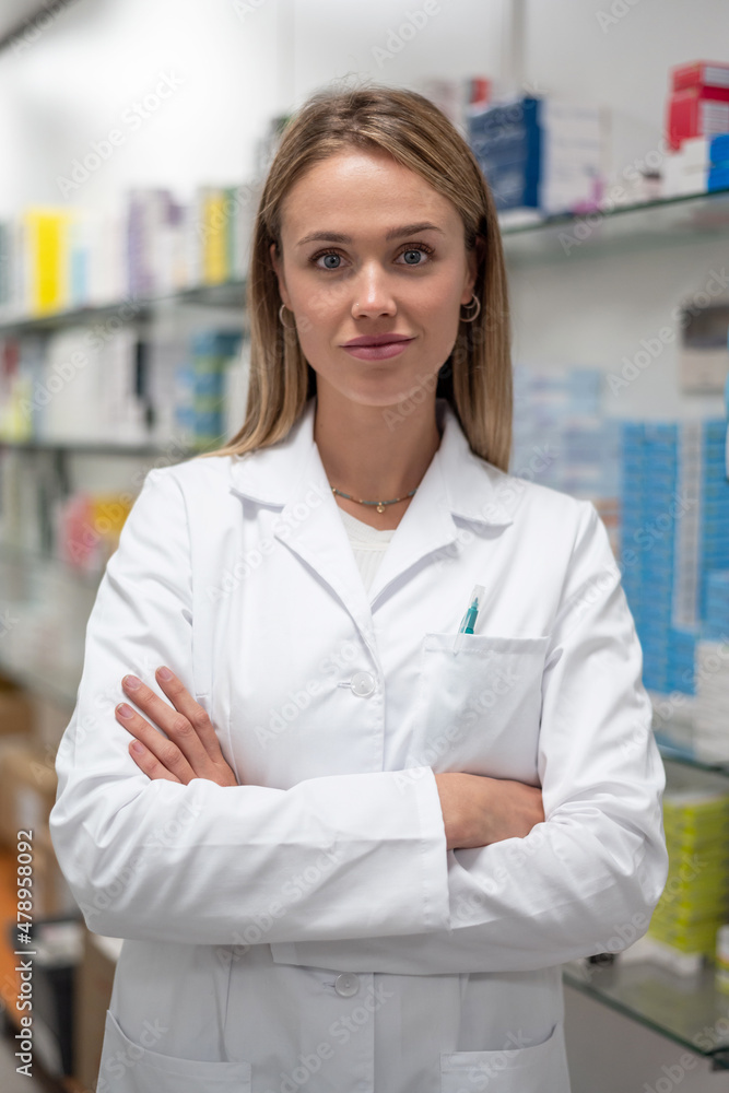 Pharmacist folding hands in drugstore Pharmacist folding hands in drugstore