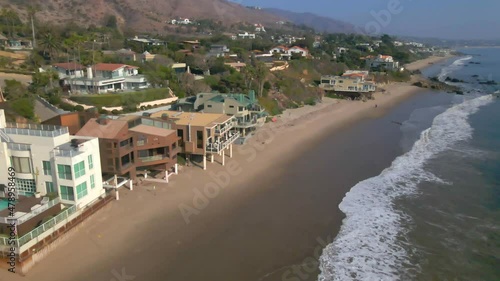 Aerial view of homes at the beach facing the ocean in Malibu California photo