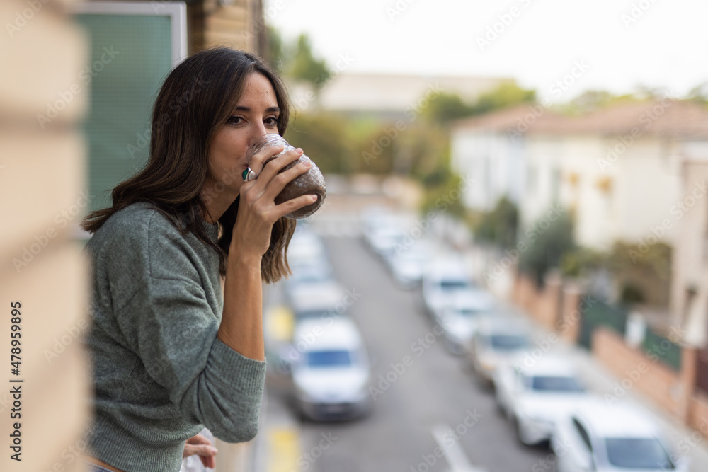 Woman with juice breathing fresh air Woman with juice breathing fresh air