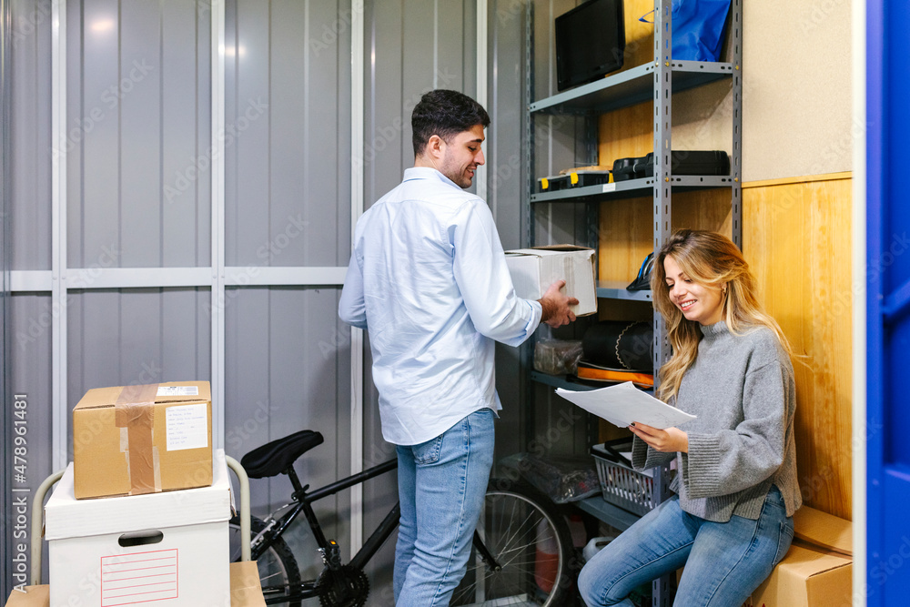 Young couple standing in office Young couple standing in office