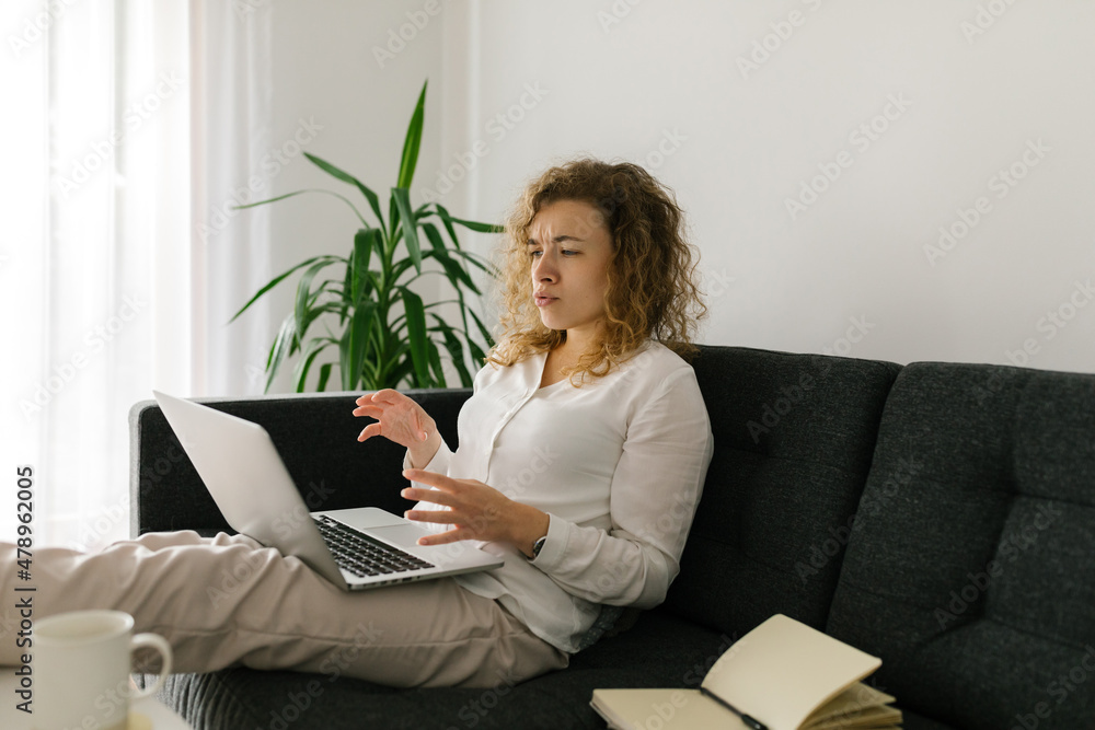 Woman having video call meeting using laptop at home Woman having video call meeting using laptop at home
